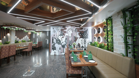 Modern restaurant with stylish ceiling design and artistic wall decor at Pipul Utkal Continental, Jharsuguda.