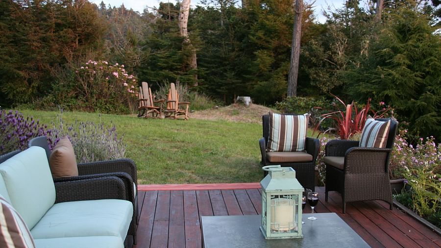 A charming garden-side seating area with a view - Brewery Gulch Inn & Spa