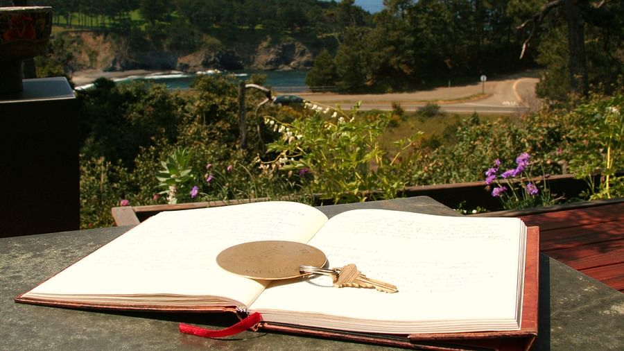 A book with a key resting on an outdoor table - Brewery Gulch Inn & Spa