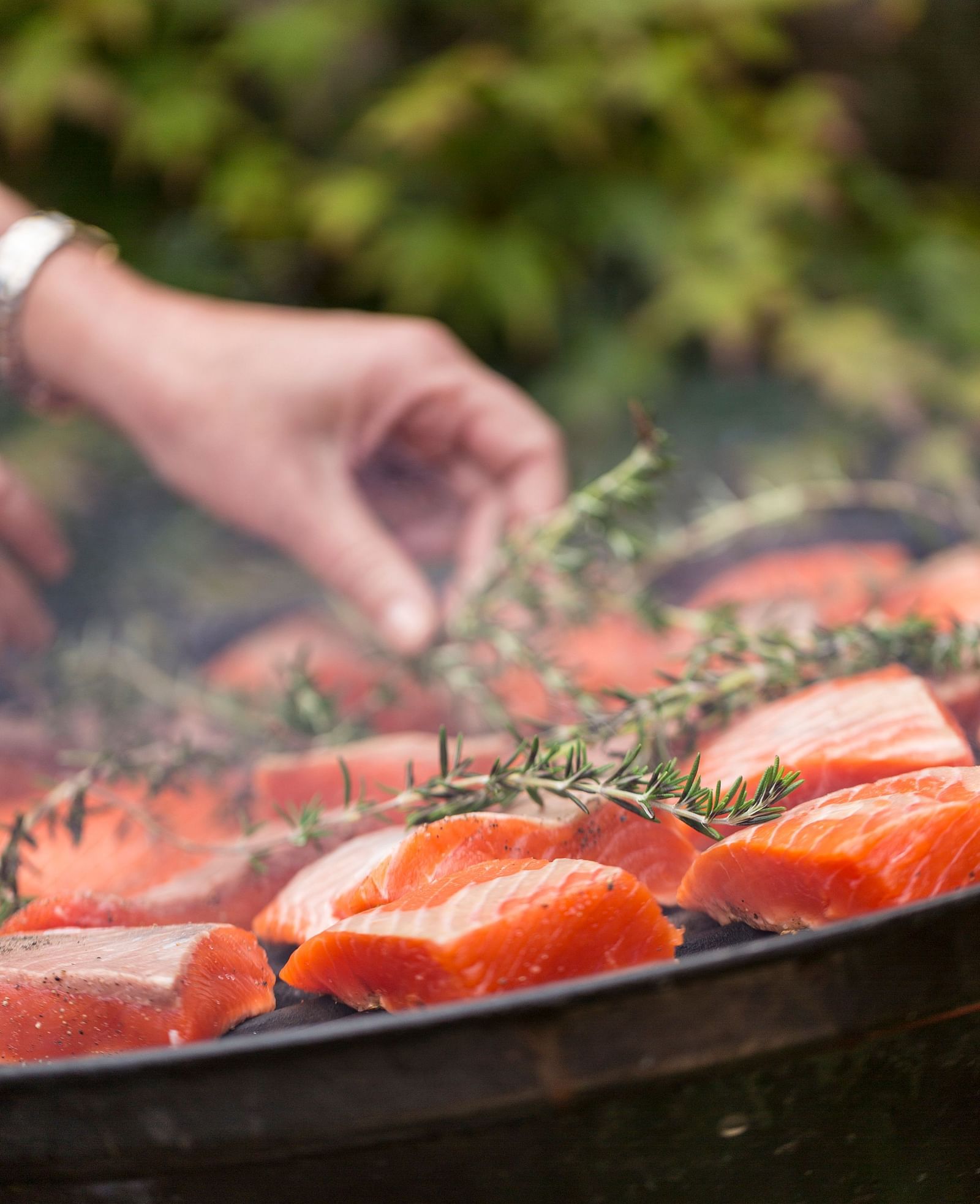 A close up of Salmon being grilled in the open - Brewery Gulch Inn & Spa