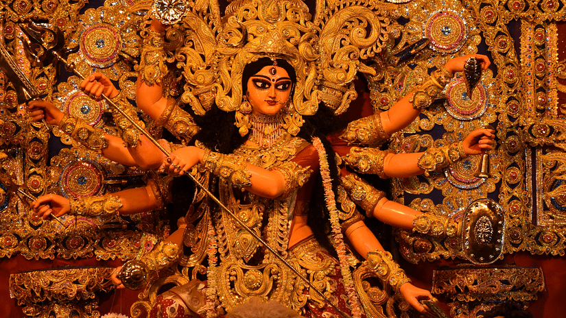 Statue of an aggressive Kali with ten hands at a temple