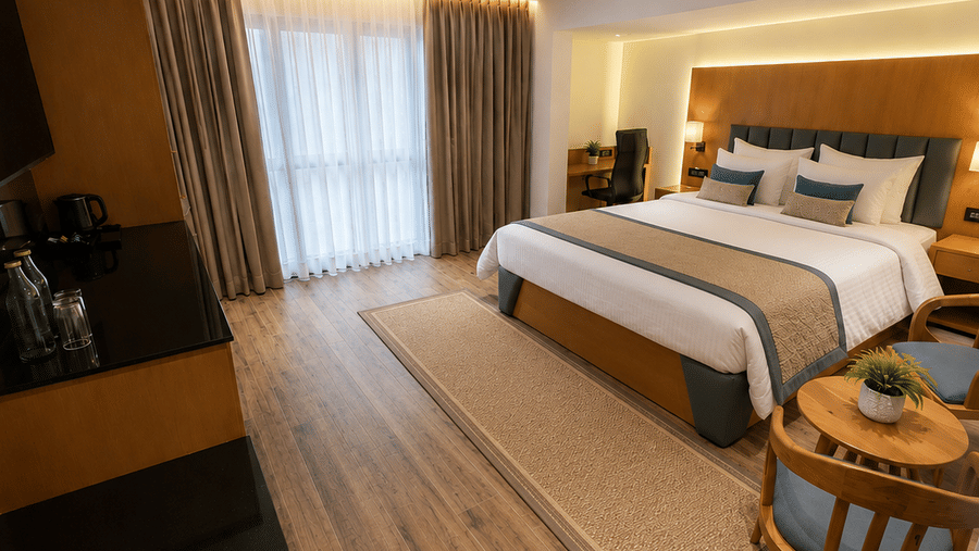 A Premium Room's bedroom with a large bed, wooden flooring, and a window at BluSalzz Collection - Casa Onze, Arpora.