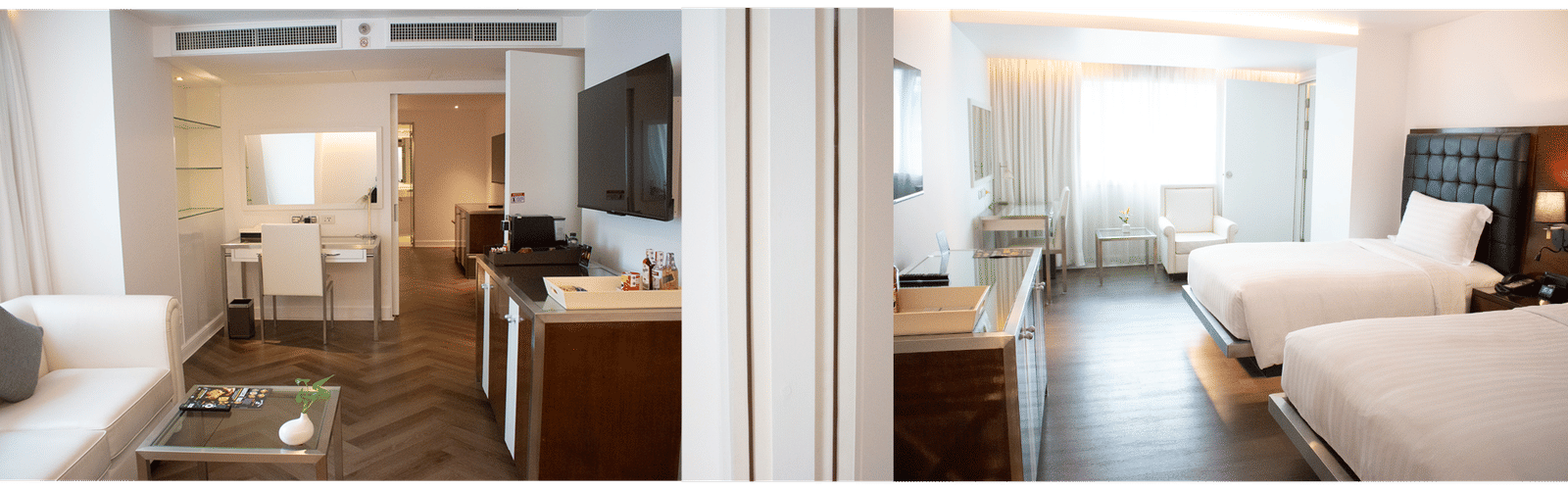 Guest room at Night Hotel Bangkok with twin beds and wooden flooring.