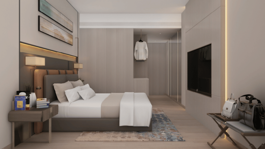 Executive Room at Tulip Inn Bidar featuring a double bed, nightstand, wall-mounted television, open wardrobe area, and a luggage stand.