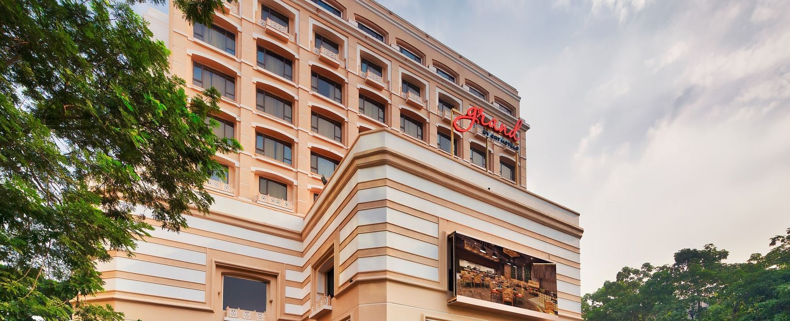 Facade of Grand Chennai By GRT Hotels during daytime.