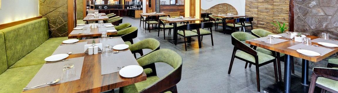 An image of Sumitel Queensyard restaurant with seating arrangements