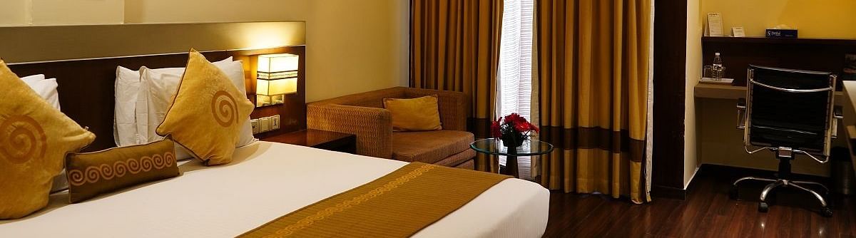 Club Room featuring a cosy bed and work desk at Shervani Nehru Place, New Delhi