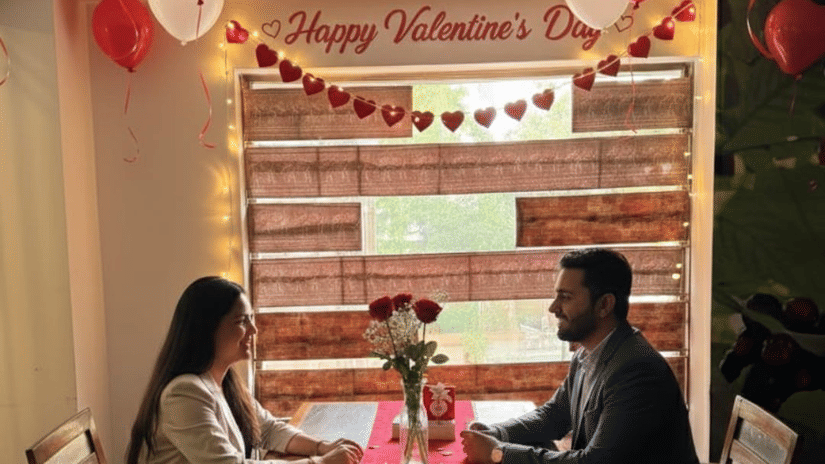 Romantic candlelight dinner setup with heart decor at Pride Plaza Ahmedabad for Valentine’s celebration.