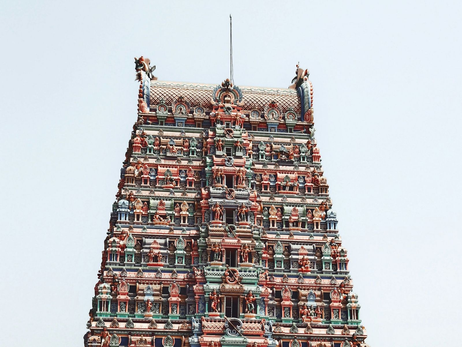 Image of a Temple with intricate carvings of Hindu gods.