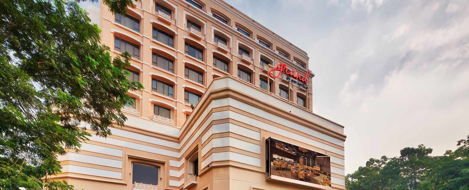 Facade of Grand Chennai By GRT Hotels during daytime.
