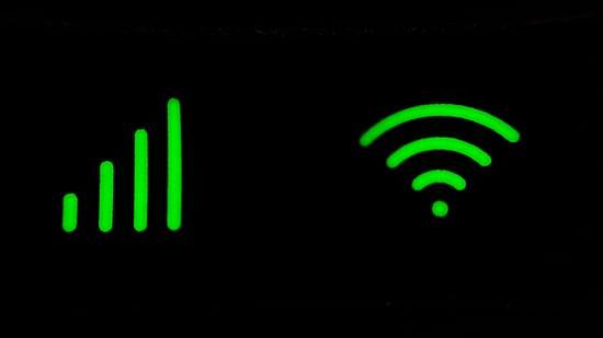 A green Wi-Fi symbol against a black background