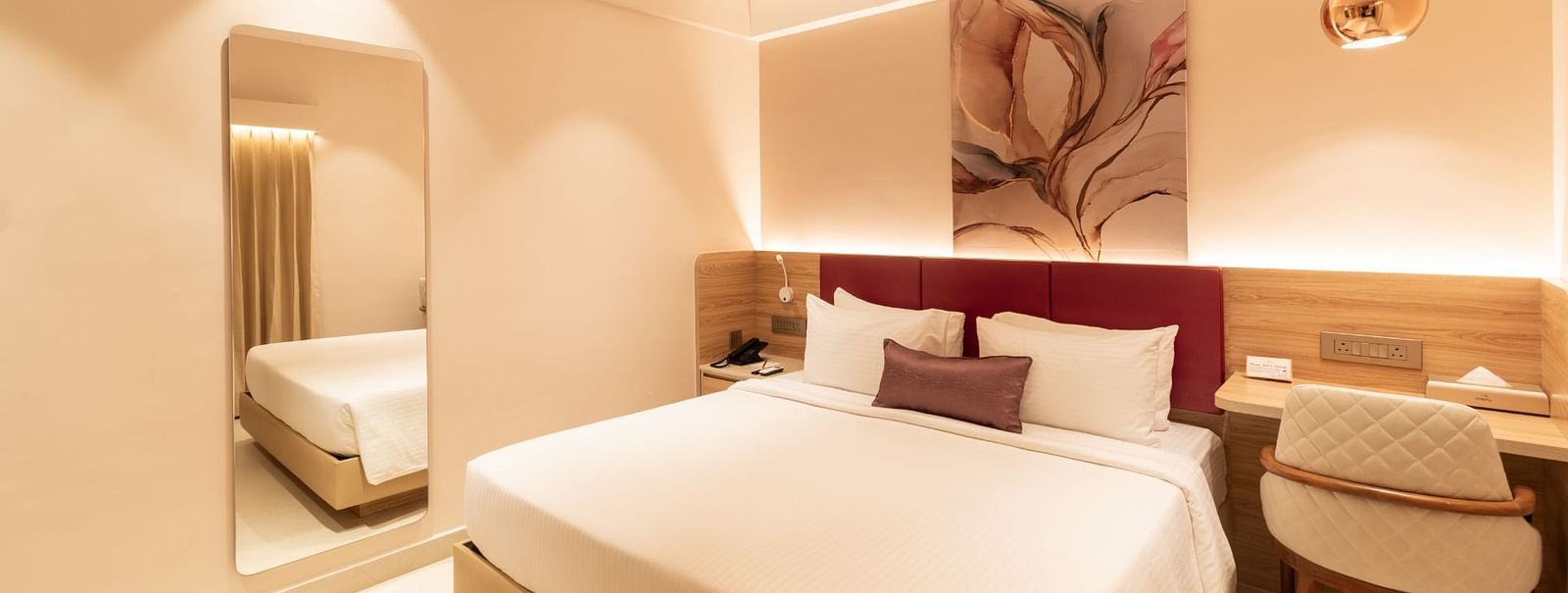 Comfortable bed setup in The Premium Rooms at Livancia The Sojourn, Bangalore.