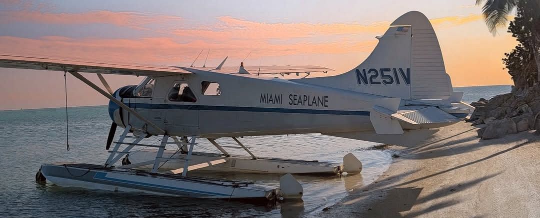 Scenic seaplane docked on the shore during sunset at Casa Morada.