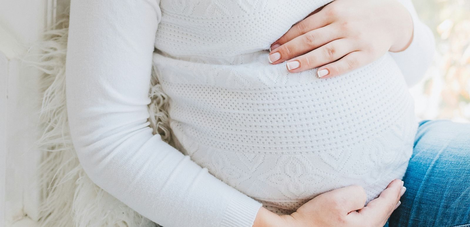 A close-up of an expecting mother’s belly