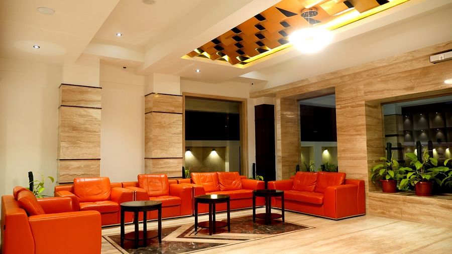 lobby with comfortable chairs and warm lightining of ASR Parklane, Hosur
