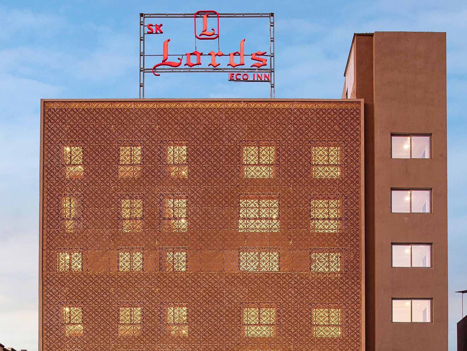 Another exterior shot of the hotel, possibly highlighting the entrance area - SK Lords Inn Ahmedabad