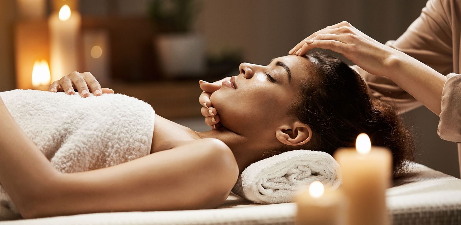 A person receiving a massage in a spa setting.