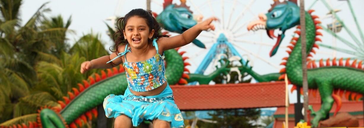 a kid jumping in the air at MGM Dizzee World
