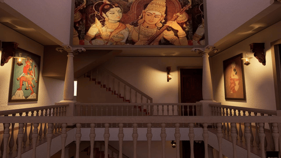 Corridors at MGM Beach Resort, Kumbakonam featuring stairs and walls with photo frames and paintings