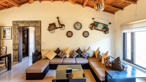 Cosy indoor lounge with wooden ceiling and ethnic decor elements at BluSalzz Collection - Suvaasa Resort, Ramgarh.