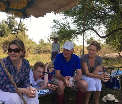 image featuring a group of Tourists sitting in a field at dev shree, deogarh