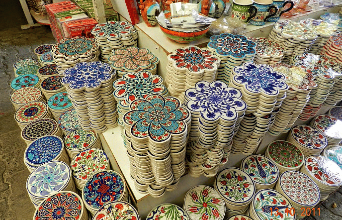 An image of a store with dishes painted with various designs