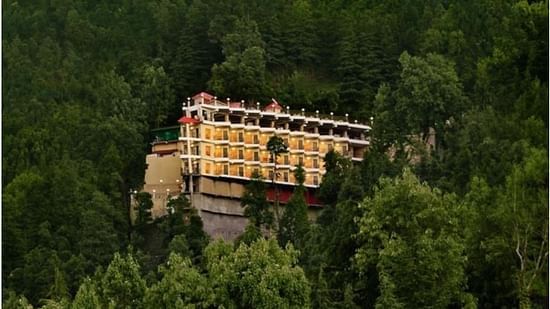 Facade of JK Clarks Exotica in Dalhousie amidst lush greenery