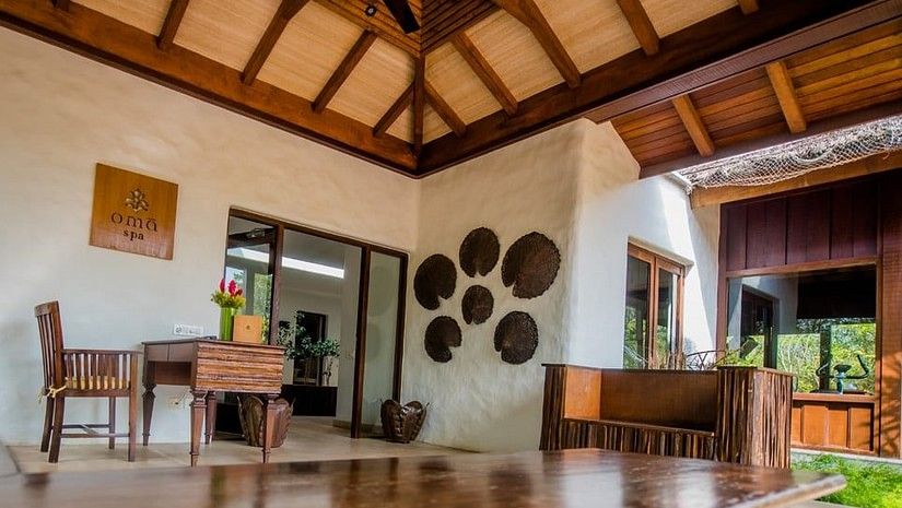 An overview of the Spa with a wooden massage table in view at The Serai Bandipur