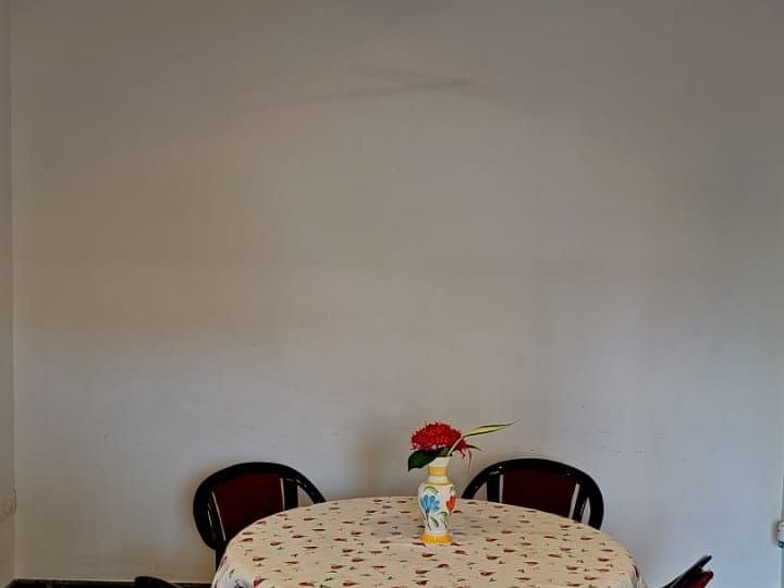 Image of a round table with four chairs around it at Villa Serenity Le Sejour Pondicherry.