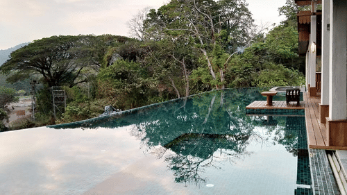 view of the swimming pool from our bar in port blair - sunset deck - Symphony Samudra Beachside Jungle Resort And Spa, Port Blair