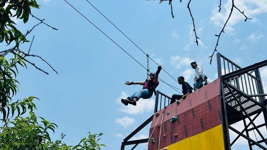  A different angle of the climbing wall's upper portion, emphasizing its structure and the scenic surroundings - Digantaa Resort in Mukteshwar