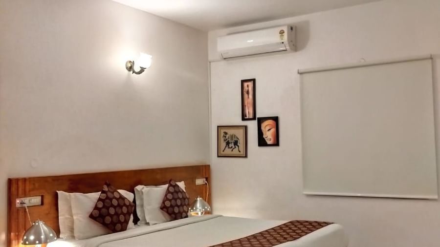 Spacious guest room with twin beds and warm lighting at Fantasy Golf Resort.