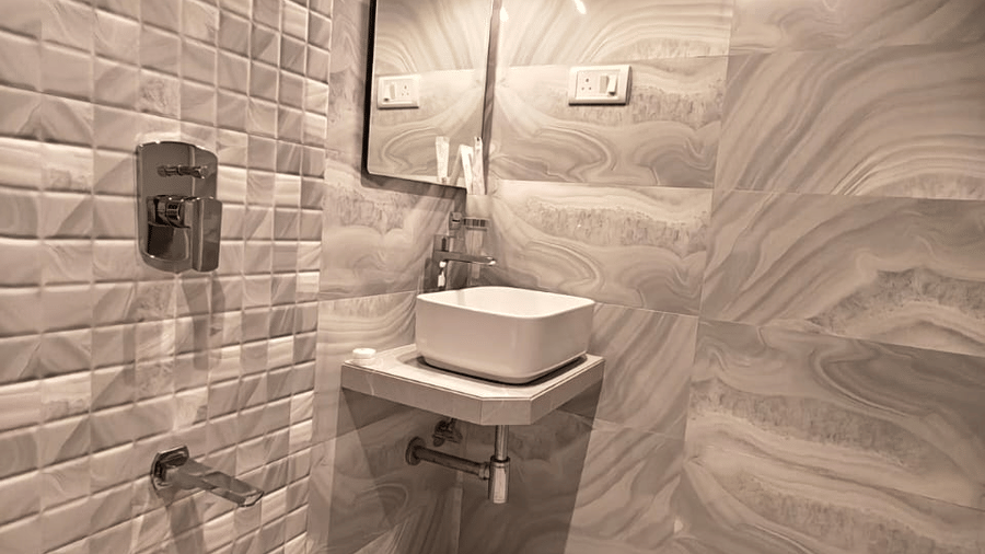 Modern ensuite bathroom with stylish fittings at Home2 Residency, Mumbai Airport