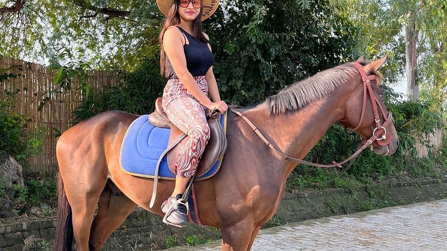 A woman riding on a horse at Themis Mudhouse - A Nature's Retreat Resort & Wellness