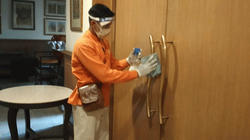 heritage staff santising the resort