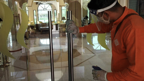 heritage staff santising the resort