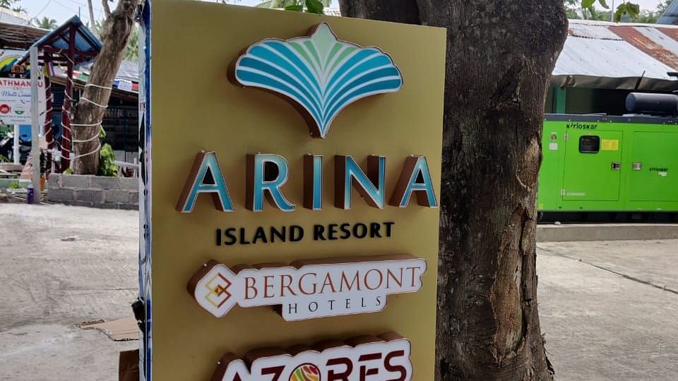 Shot of a display board in the resort that states the name of the dining section | Arina Island Resort
