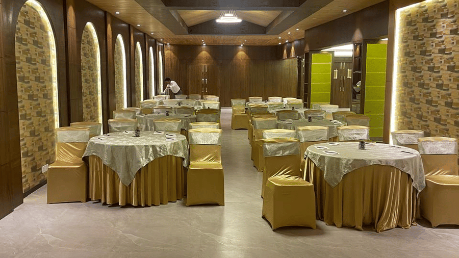 Decorated Jasmine Hall at Best Western Plus Revanta Resort & Spa with arranged seating, patterned walls, and ambient ceiling lights.