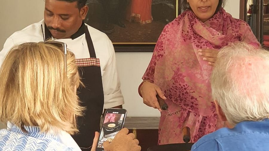 Tourists attending the cooking classes at Dev Shree, Deogarh
