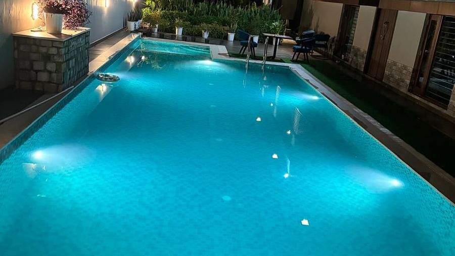 image of the swimming pool taken during the night at Eminence The Corbett