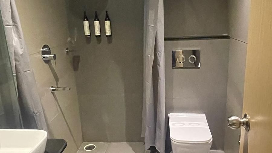 Modern bathroom with glass shower and sleek design at Hotel Kyzen HiTech City – Your Zenly Stay