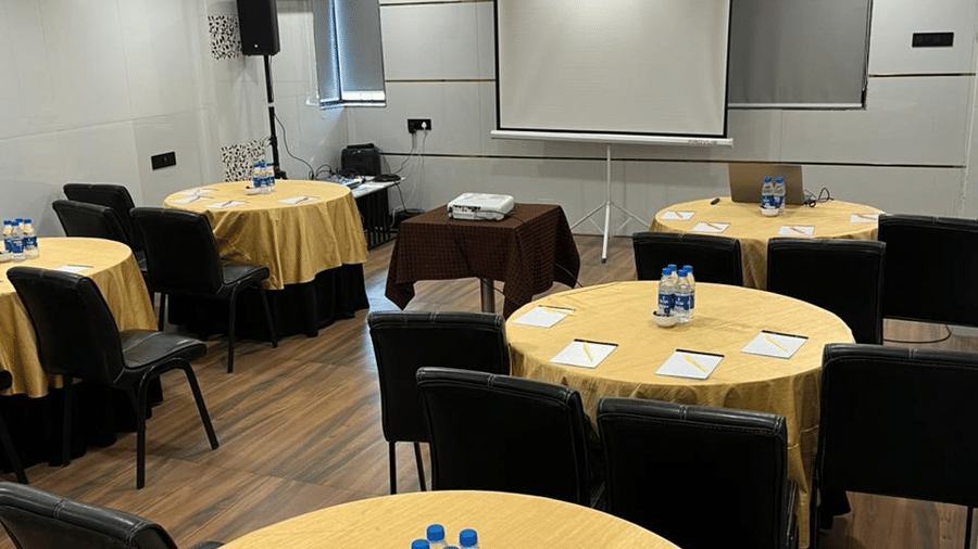 Conference room with round table setup, suitable for meetings and discussions.