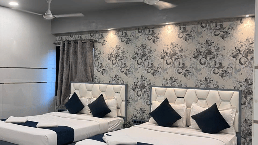 Premium hotel room with a large bed, stylish interiors, and cozy ambiance for a restful stay.