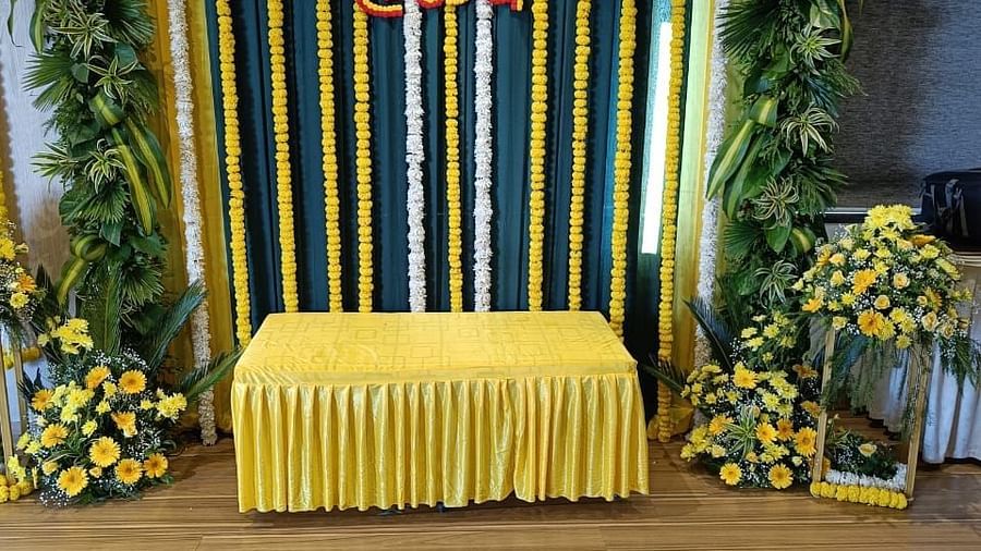 Image of a pulpit decorated with plants and flowers at at The Oriental Residency
