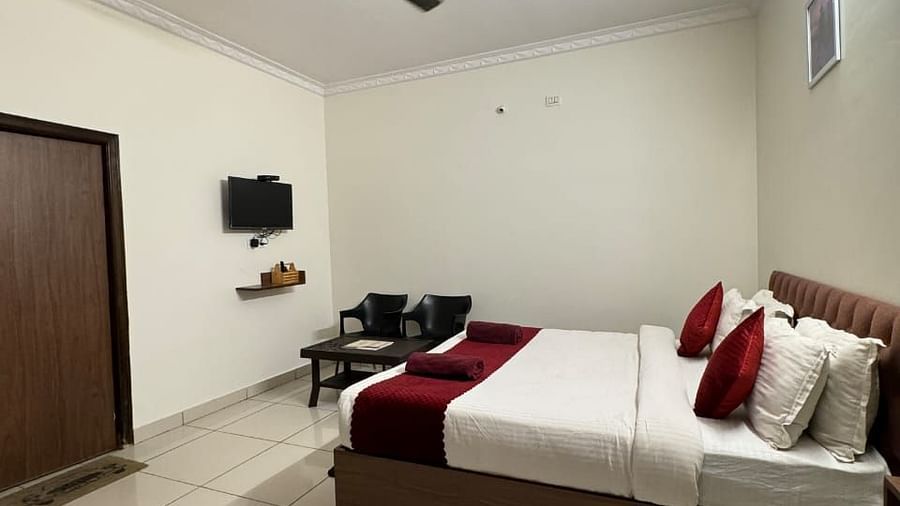 A side view of a bed in a bedroom | Vistar Resort, Bengaluru