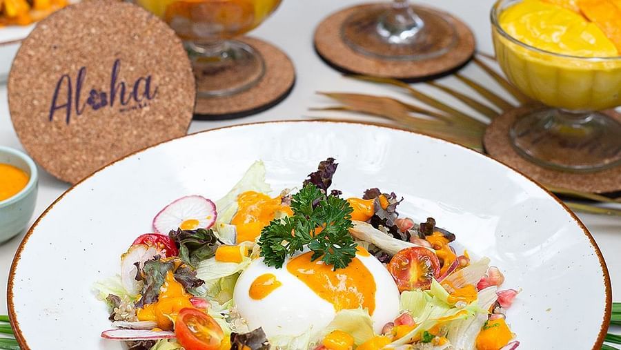 Gourmet tropical vegetable dish with mango drinks and desserts at Hotel Mumbai House Mindspace, Malad.