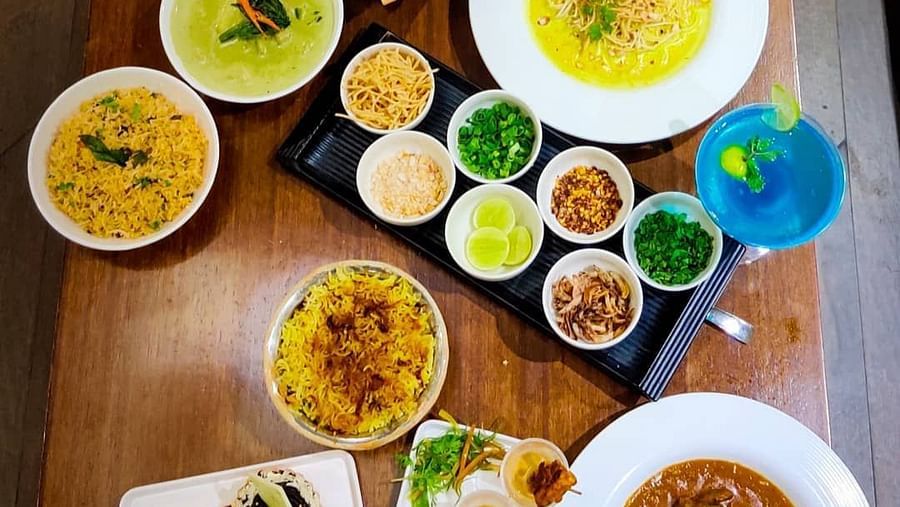A buffet featuring several dishes rests on the table - Rhythm Lonavala