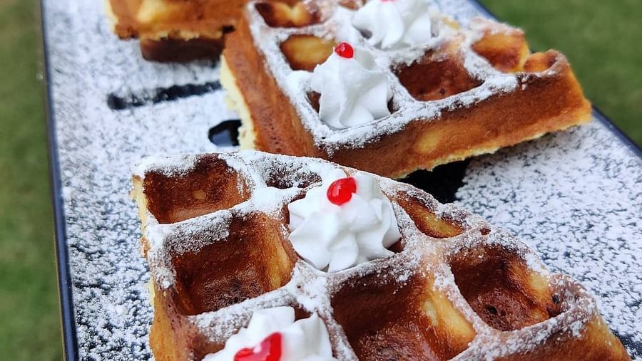 Waffles lined up on a table - Rhythm Lonavala