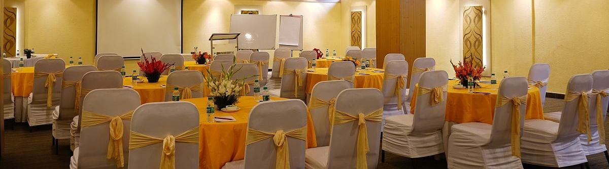yellow and white chairs at our banquet hall at Shervani Nehru Place, New Delhi