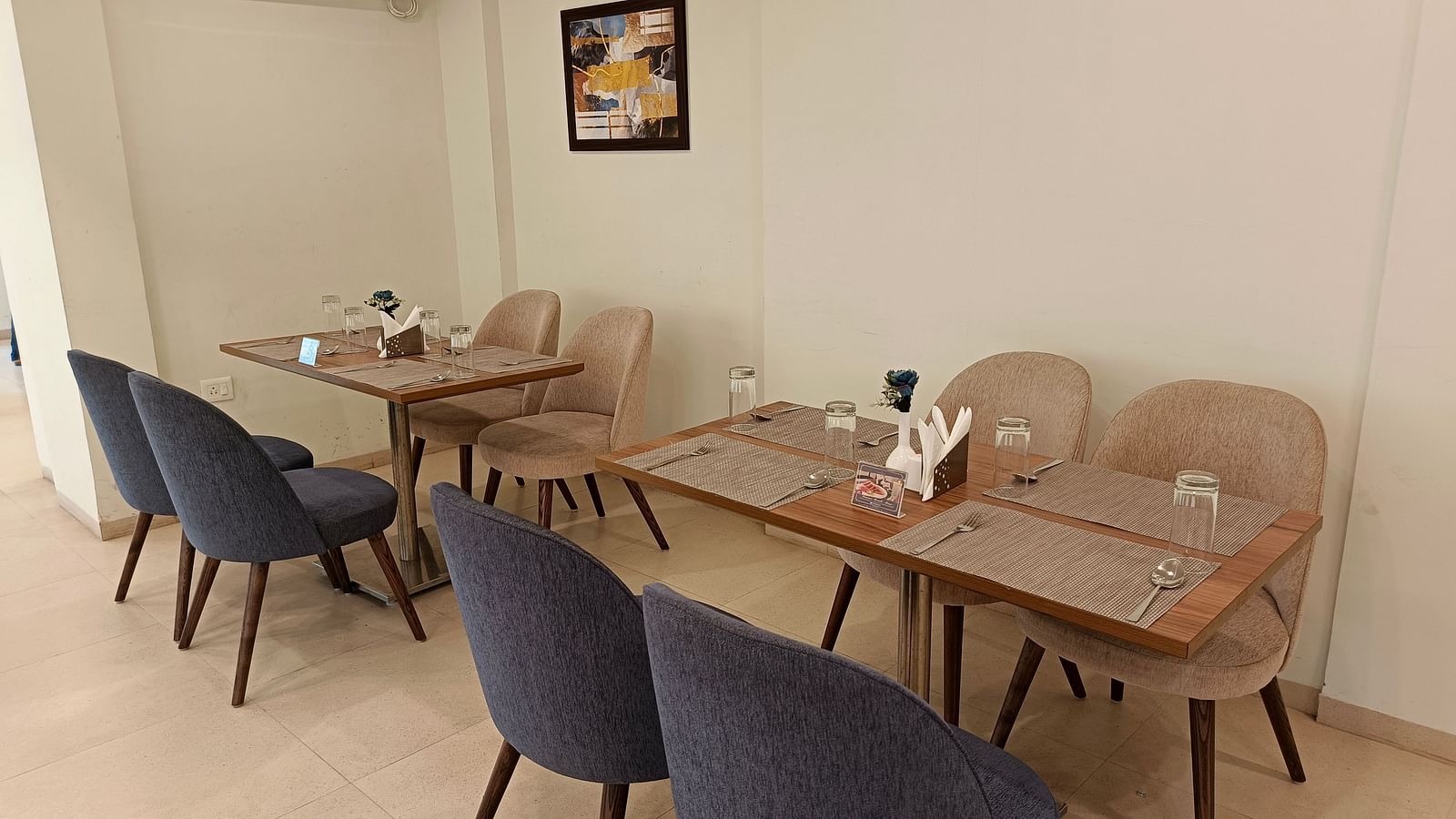 Seating arrangement inside the restaurant - Starlit Suites, Shirdi
